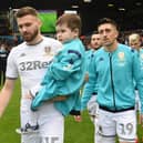 SPECIAL MEMORY - Leeds United's Stuart Dallas carrying Eddie Franks out onto the Elland Road pitch, not long after the youngster was diagnosed with leukemia. Pic: LUFC