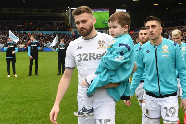 SPECIAL MEMORY - Leeds United's Stuart Dallas carrying Eddie Franks out onto the Elland Road pitch, not long after the youngster was diagnosed with leukemia. Pic: LUFC