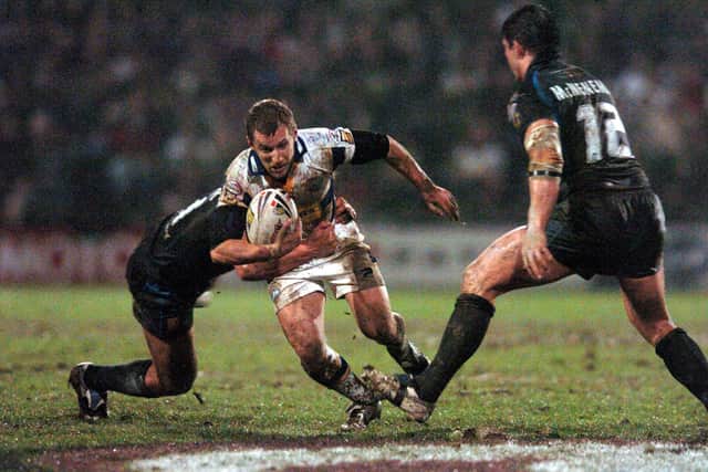 Headingley's famous pitch was in a mess by the 2000s. Rob Burrow squelches through the mud against Hull in Rhinos' first home game of 2007. Picture by Steve Riding.