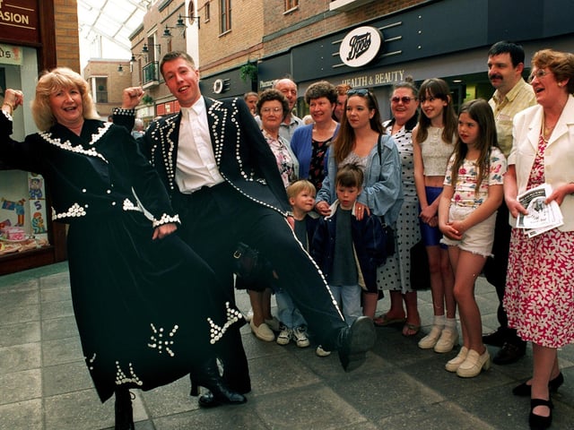 Oi!.. Pearly King and Queen Mike Chisem and Dianne Ransome, members of Kippax Amateur Operatic Society, were at Carlton Lanes Shopping Centre to promote the Society's show Me and My Girl in May 1997.