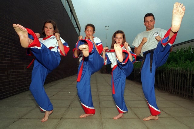 Instructor Kevin Downes kicking out in Boston Spa with karate girls, from left, Anna Keen, Francesca Warren-Price and Melissa Udal in July 1997.