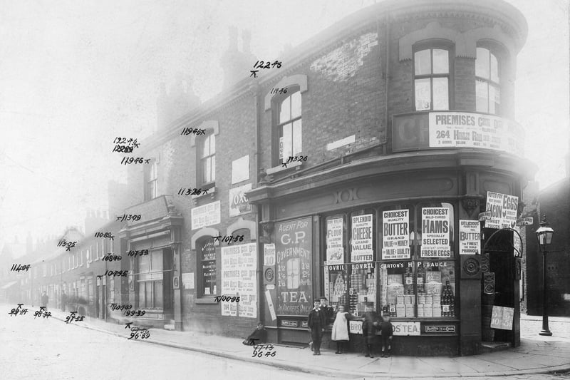 Numbers 2/4 at the junction with Church Street, business of William Cussons Ltd grocers. The shop is covered with posters, some advising that the business is to move to 264 Hunslet Road. The others note goods in stock, including tea, flour, butter, cheese, ham, eggs, bacon, Bovril, HP sauce. Children in front of window in period dress. Pictured in August 1904.
