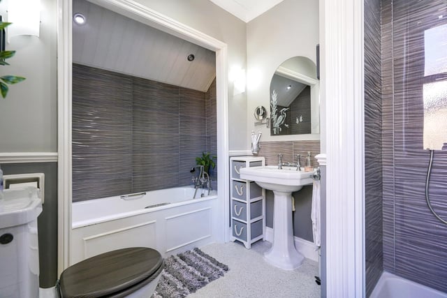 The modern house bathroom is completed with a four piece suite.