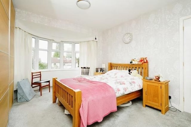 The second bedroom features this attractive bay window, making the room feel light and airy.