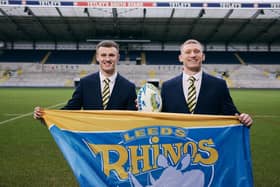 Leeds Rhinos' Ash Handley and Mikolaj Oledzki celebrate Skopes becoming the club's official tailoring partners for 2025. Picture by Rob Smalley.