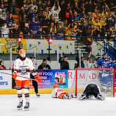 THE JOY AND THE DESPAIR: Leeds Knights' players celebrate Matt Bissonnette's game-winning strike as Sheffield Steeldogs' players show their frustration. Picture: Miles Tidman/Knights Media.