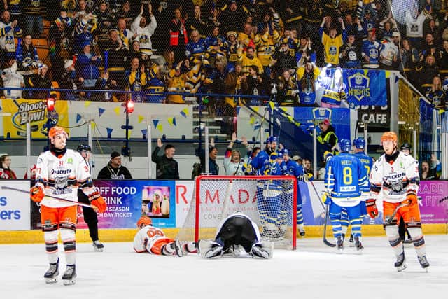 THE JOY AND THE DESPAIR: Leeds Knights' players celebrate Matt Bissonnette's game-winning strike as Sheffield Steeldogs' players show their frustration. Picture: Miles Tidman/Knights Media.