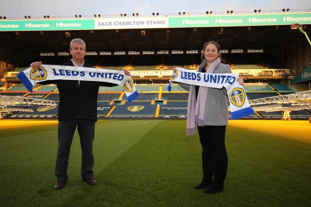 Hisense branding unveiled on the new Jack Charlton Stand at Elland Road by his son-in-law and granddaughter David and Emma Wilkinson