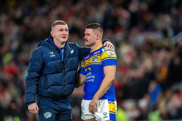 A tearful Harry Newman, who missed the final through injury, with James Bentley at full time after Rhinos' Grand Final defeat by St Helens on September 24.