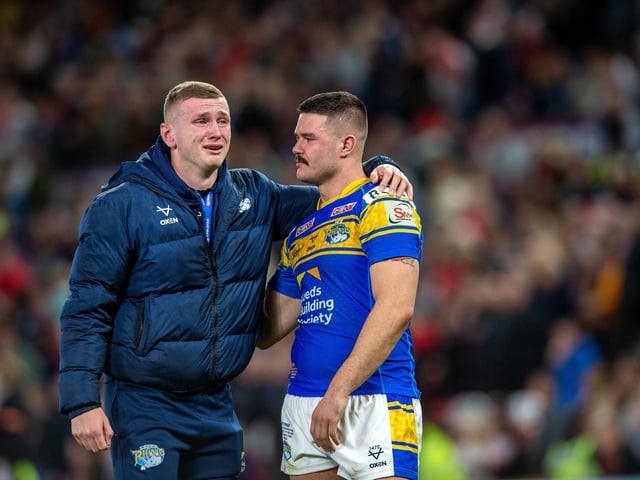 A tearful Harry Newman, who missed the final through injury, with James Bentley at full time after Rhinos' Grand Final defeat by St Helens on September 24.