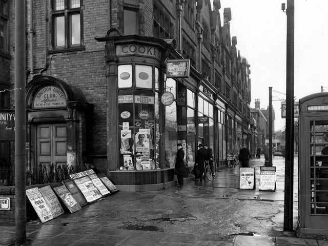 Chapeltown Road at the junction with Mexborough Avenue in January 1954. Shops include 'Cookes Tobacconists and Newsagents', and 'Isaacs Fruit Shop'. On the left is the Kingston Unity Club.