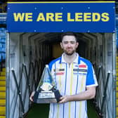 World darts champion Luke Humphries took the Premier League trophy to Elland Road ahead of Thursday night's  event at FD Arena. Picture by Dan Richardson/Leeds United/PDC