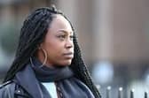 Image of a black woman looking thoughtfully into the distance