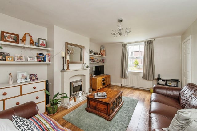The lounge area features a double glazed window to the front aspect, a feature fire place with an electric fire, surround and a hearth plus two gas central heating radiators. Photo: Zoopla