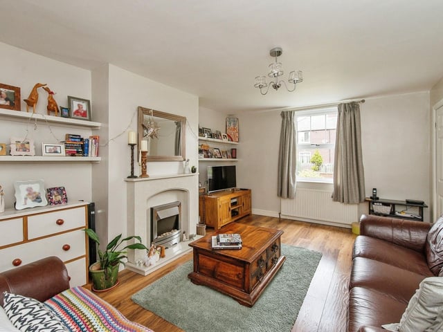 The lounge area features a double glazed window to the front aspect, a feature fire place with an electric fire, surround and a hearth plus two gas central heating radiators. Photo: Zoopla