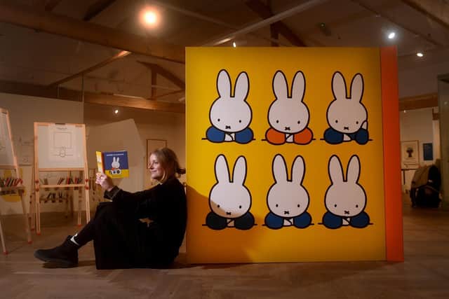 Laura Irwin looks at one of the books in the Miffy exhibition at the Leeds City Museum.