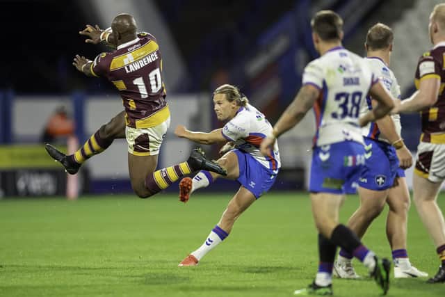 Jacob MIller attempts a drop goal on his final appearance for Wakefield Trinity. (Picture: Allan McKenzie/SWpix.com)
