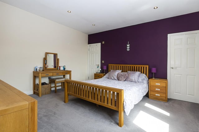 The house has four to five bedrooms, two of which have en suite facilities.