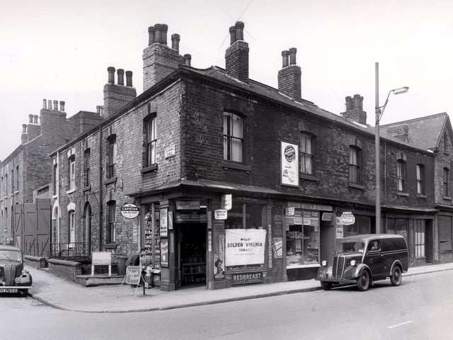 Crawford Street is on the left, at the corner is 37 Meanwood Road, a shop selling a large variety of sweets and tobacco. Next 39 is Lily's snack bar, cooked meats and groceries were also sold. Numbers 41 to 47 have no indication of use except 47 on the right has a faded sign for L. Kaye. Glover Place is on the right. Pictured in June 1958.