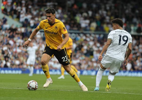 CHIEF THREAT: Recently returned Leeds United top scorer Rodrigo, right, as the Whites take on Wolves and Max Kilman, left. Photo by David Rogers/Getty Images.