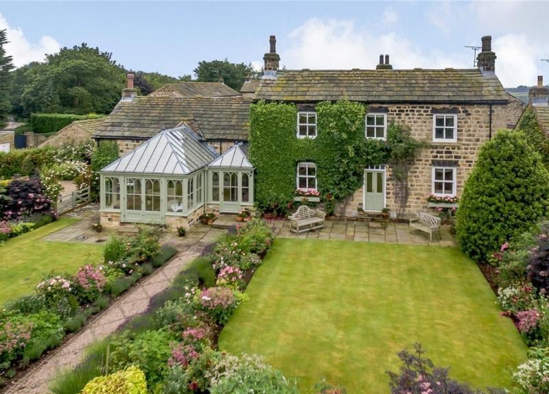 The Farmhouse on Manor House Lane was sold in August 2022 for £1,900,000 - the first time it had been on the market since 1996. The home is set in approximately 1.5 acres of grounds and has many period features throughout.