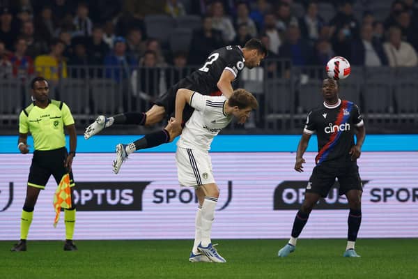 MORE MINUTES: Leeds United striker Patrick Bamford is challenged by Joel Ward in Friday's pre-season friendly against the Eagles at the Optus Stadium in Perth. 
Photo by Paul Kane/Getty Images.