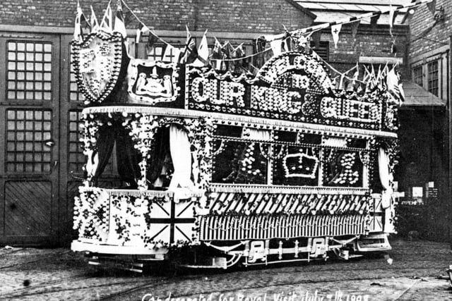 Part of the celebrations had been the commission of an illuminated tram. It started running on the night of the Royal visit and the following week visited every part of the city. This photograph was taken of the tram when it had passed Horsforth and gone on to White Cross, Guiseley. On the side is the slogan 'Welcome to our King and Queen'. This was the first visit of a reigning king to Leeds since Charles II.