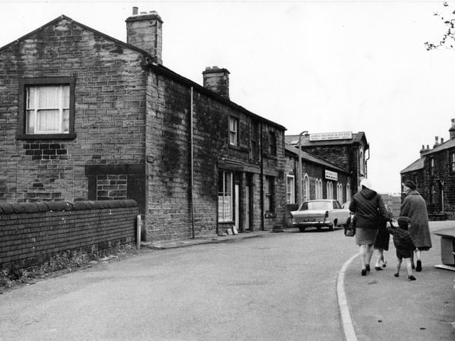 Two women and two children walk along Troy Road in August 1968.