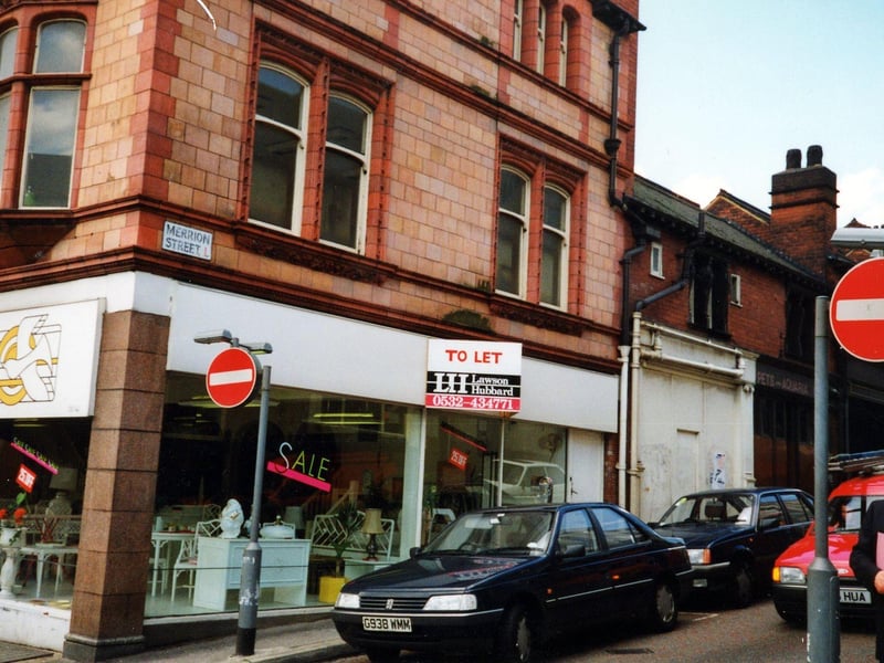 Merrion Street seen from the junction with Vicar Lane in October 1990. On the corner, the furniture store, Paloma Blanca is having a sale; a notice advertises the premises as 'To Let'.