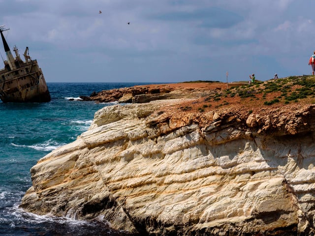 Paphos is a city on the southwest coast of the Mediterranean island of Cyprus. Inhabited since Neolithic times, it has several sites relating to the cult of goddess Aphrodite, whose mythical birthplace was at Old Paphos.