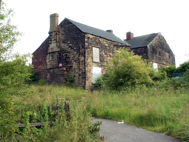Stank Hall on Dewsbury Road was built in the late 15th century for the Beeston family. It has been listed as Grade II by English Heritage since October 1951. Immediately to the north stands a Grade II listed barn of the late 15th to early 16th century that was also built for the Beeston family and was acquired by the Hodgson family in the 17th century.
