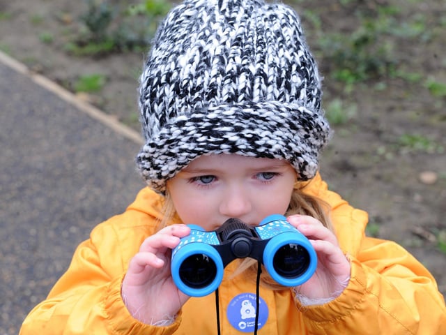 Activities included making wildflower seed bombs, a wildlife walk and crafts. Pictured looking for wildlife is three-year-old Domi Wachowska.