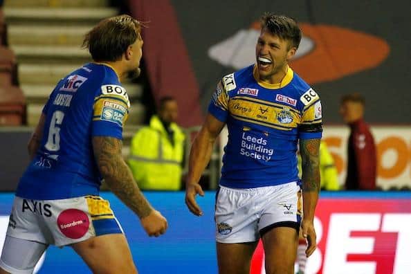 Tom Briscoe, right, celebrates with teammate Blake Austin as Rhinos beat Wigan to book their Grand Final spot. Picture by Ed Sykes/SWpix.com.