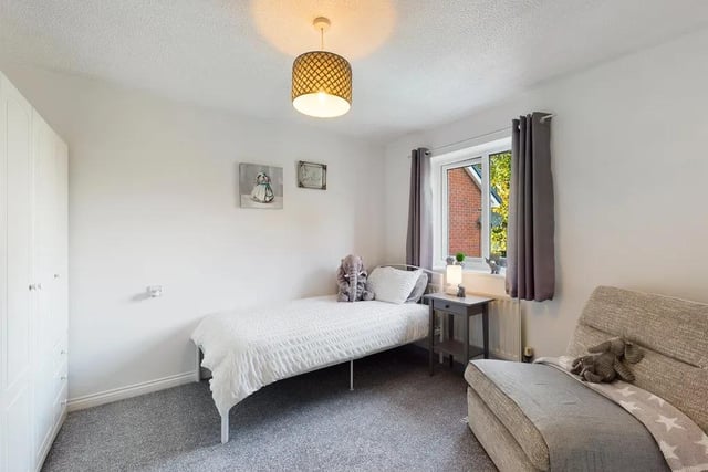 To the right of the landing is a beautifully-designed double bedroom
