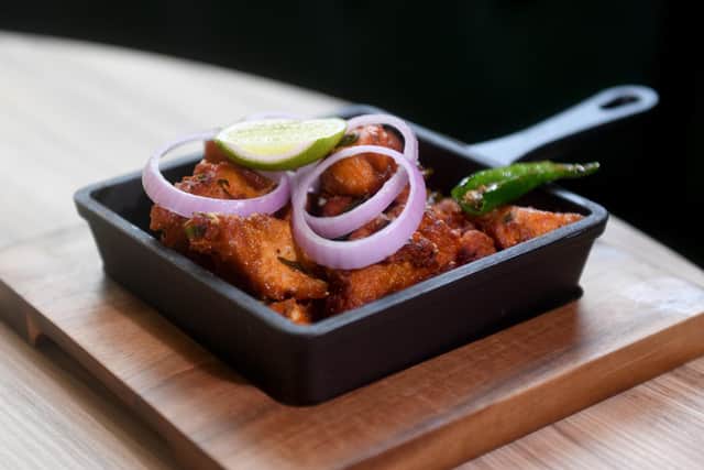 The Chicken 65 Varuval small plate - tender fried chicken pieces coated with red chillies, crispy fried and tossed with yoghurt and curry leaves. (Photo by Simon Hulme/National World)