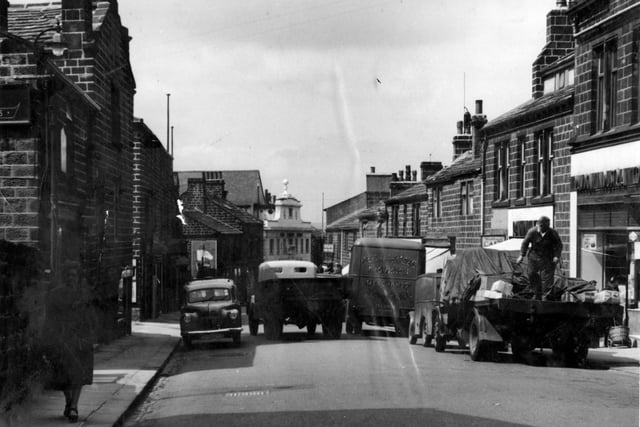 A 1950s view of Yeadon High Street, busy with delivery vehicles. The ornate white building in the centre was originally Yeadon Picture House which opened on Monday, August 3, 1925, with a showing of 'The Man Who Came Back' starring George O'Brian and Dorothy MacKaill. The silent film was accompanied by orchestral music by the Melody Quartet. Seat prices at that time were 4d and 6d in the arena and 9d on the balcony. It survived for many years as a cinema before becoming a Bingo Hall, before the building housed The Aviator pub.