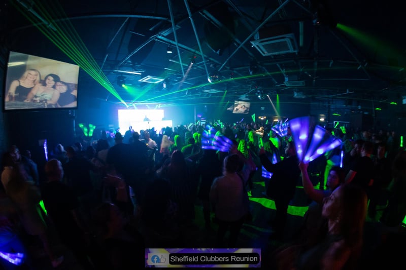 Glow sticks and pictures on the big screen add to the atmosphere at the clubbers' reunion held at the Leadmill
