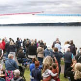 The Red Arrows dazzle spectators with their diamond nine aerobatic display across the shores of Belfast Lough