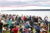 The Red Arrows dazzle spectators with their diamond nine aerobatic display across the shores of Belfast Lough