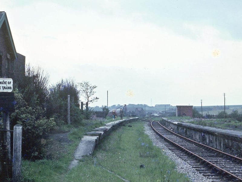 Derelict Woodkirk Station looking in the direction of Batley in May 1968. A sign on the left says 'Beware of the Trains'.