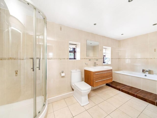 This stylish bathroom is one of five within the property.