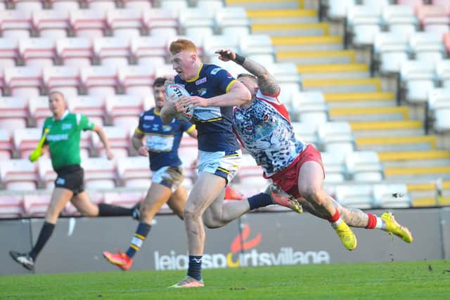 Luis Roberts breaks away to score for Rhinos at Leigh. Picture by Steve Riding.