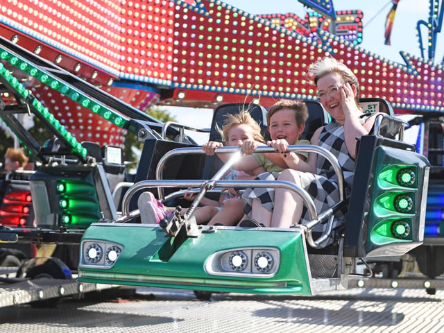 A family enjoys the fairground rides  at Harrogate Food and Drink Festival at Ripley Castle. (Picture Gerard Binks)
