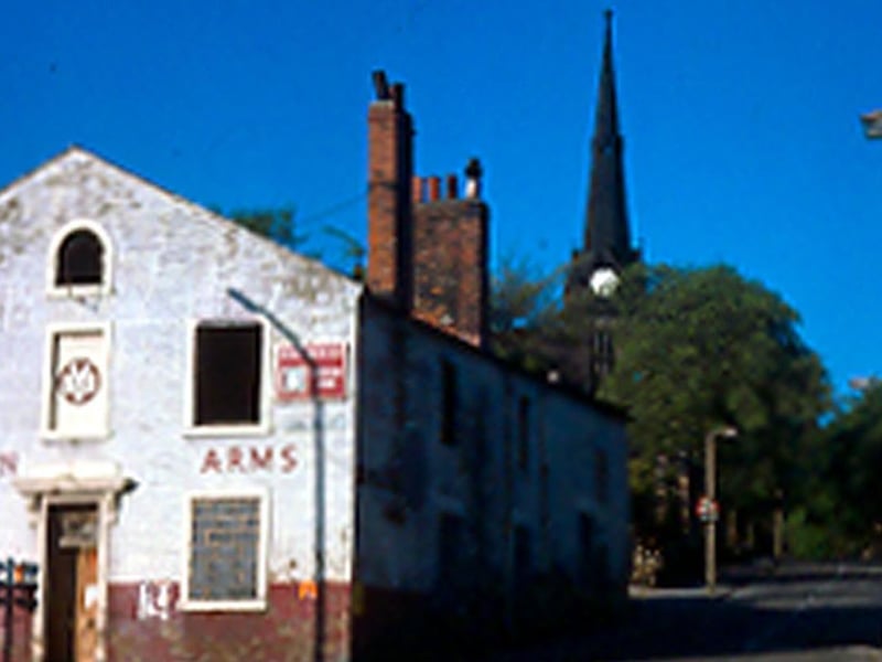 The Cardigan Arms public house on Lower Town Street, at the junction with Waterloo Lane to the right. St. Peter's Church can be seen in the background. Pictured in 1977. This pub was visited by George Orwell and demolished by the end of the 1970s. It was replaced by The Lord Cardigan.