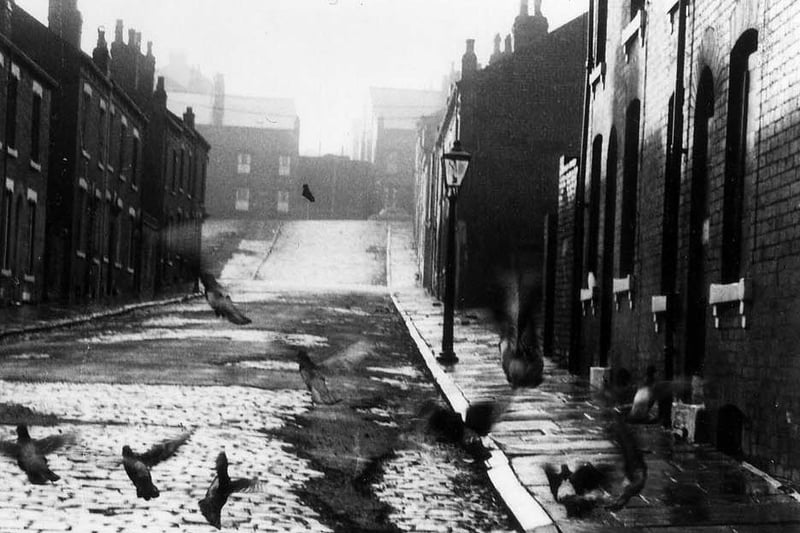 Looking south-west up Servia Place from Cambridge Road to Servia Hill in 1970. Some of the terraced housing on this cobbled street has already been demolished and the rest is due to follow as part of a large-scale clearance of the area. Servia Road crosses the street in the middle.