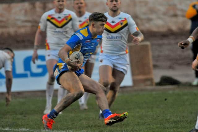 Eighteen-year-old winger Jack Smith on the attack for Leeds Rhinos against Bradford Bulls. Picture by Steve Riding.