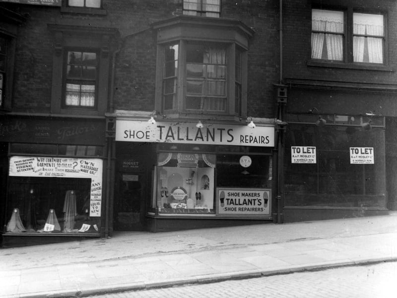 A row of three shops on Beeston Road in June 1938. They incude the premises of Abraham Marks, tailor with a window display of material swatches and the premises of Alfred T. Tallant, shoe maker.