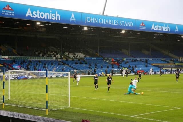 LEEDS, ENGLAND - DECEMBER 27: Nick Pope of Burnley tackles Patrick Bamford of Leeds United leading to a penalty being given  during the Premier League match between Leeds United and Burnley at Elland Road on December 27, 2020 in Leeds, England. The match will be played without fans, behind closed doors as a Covid-19 precaution. (Photo by Nigel French - Pool/Getty Images)
