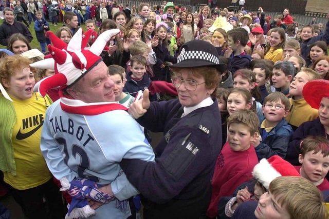 Bramley Sunnyside School, Rotherham, headmaster Richard Rutherford being arrested by WPC Pauline Richards for Comic Relief in 2001