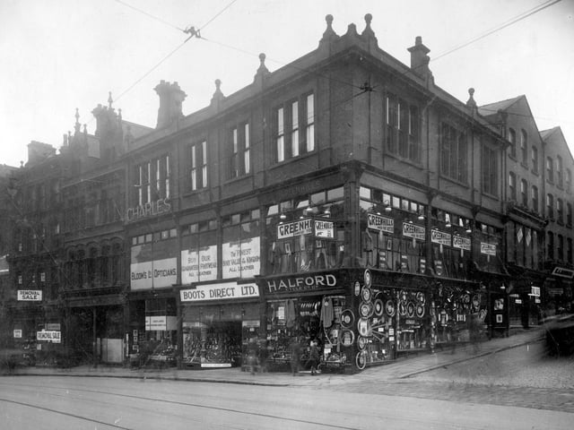 Businesses on corner of Mark Lane with New Briggate in August 1929. Right to left are Greenhills Tailors, Halford Cycle Co Ltd, Boots Direct Ltd, boot and shoe retailer and Blooms Opticians.
